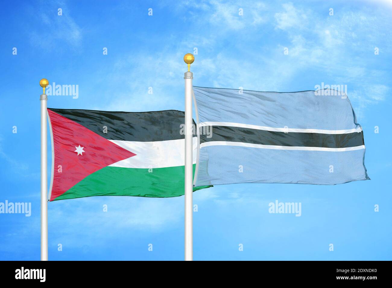 Jordan and Botswana two flags on flagpoles and blue cloudy sky Stock ...