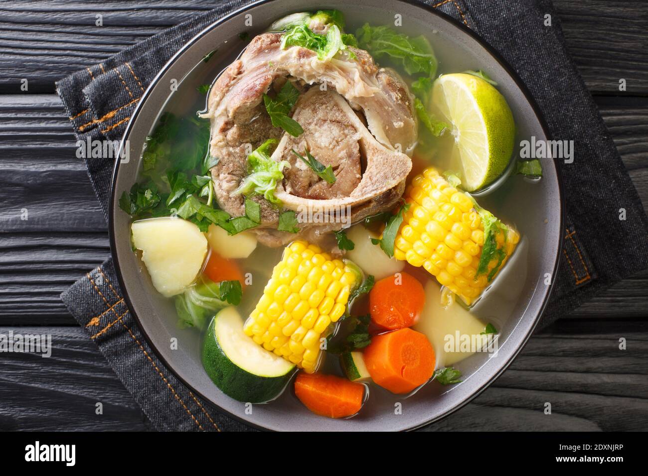 Delicious Mexican beef soup with vegetables close-up in a bowl on the table. horizontal top view from above Stock Photo