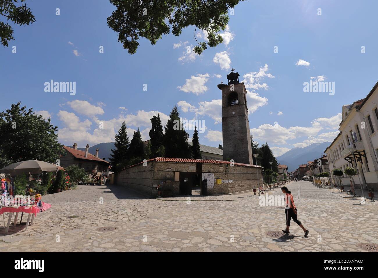BULGARIA, BANSKO  - AUGUST 02, 2019: Holy Trinity Church with Pirin Mountains in the background Stock Photo