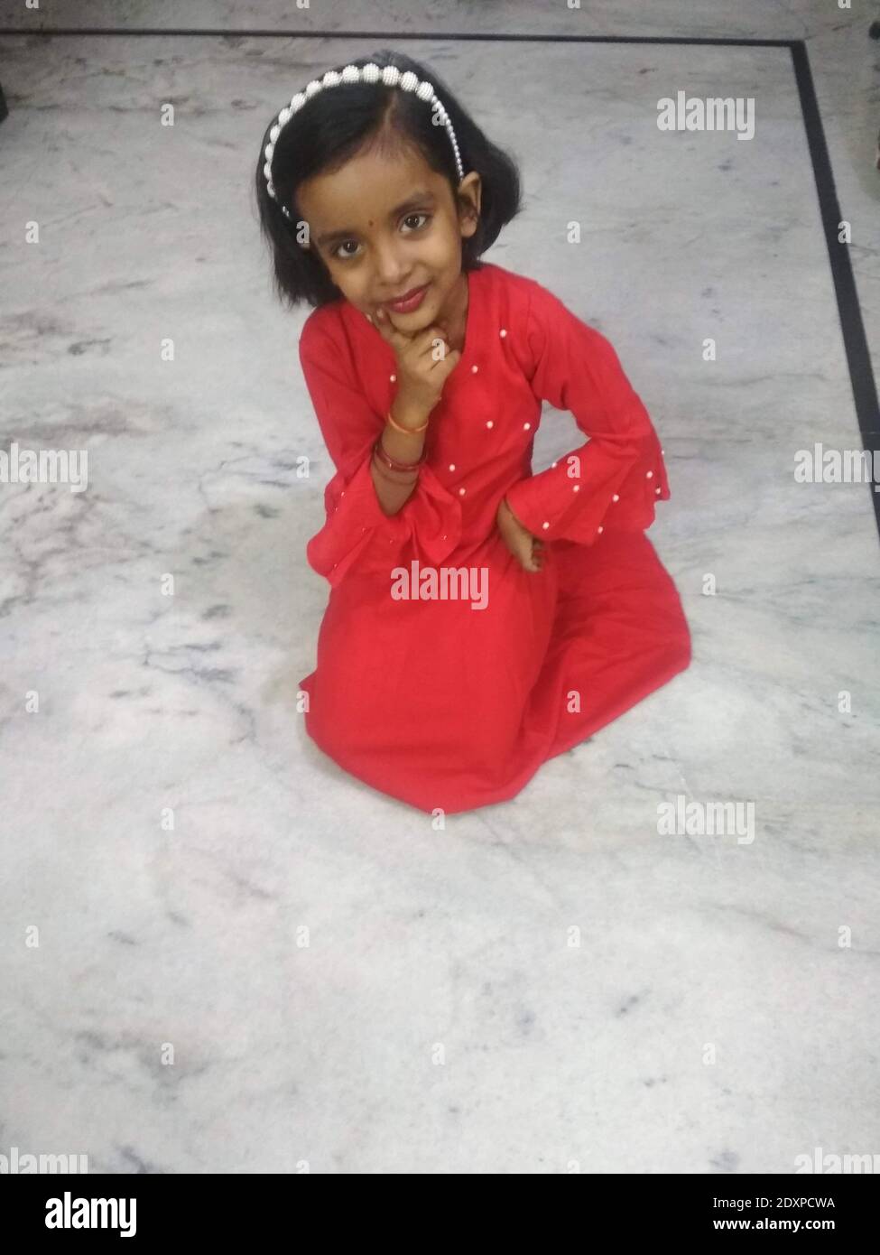 Portrait girl kneeling on floor hi-res stock photography and images - Alamy