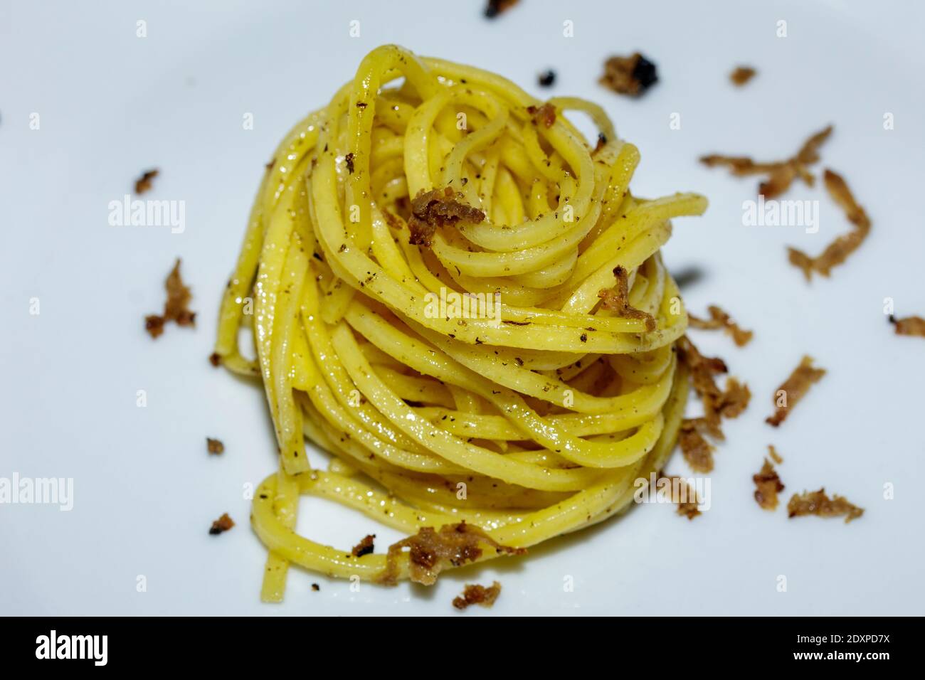 Homemade tagliolini with truffles. Simple but tasty recipe based on fresh pasta, truffle (white or black) and butter. Stock Photo