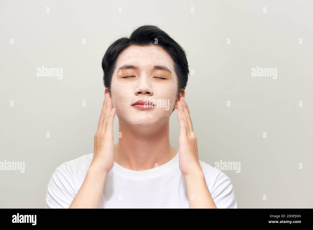 Male wearing clay face mask beauty treatment Stock Photo Alamy