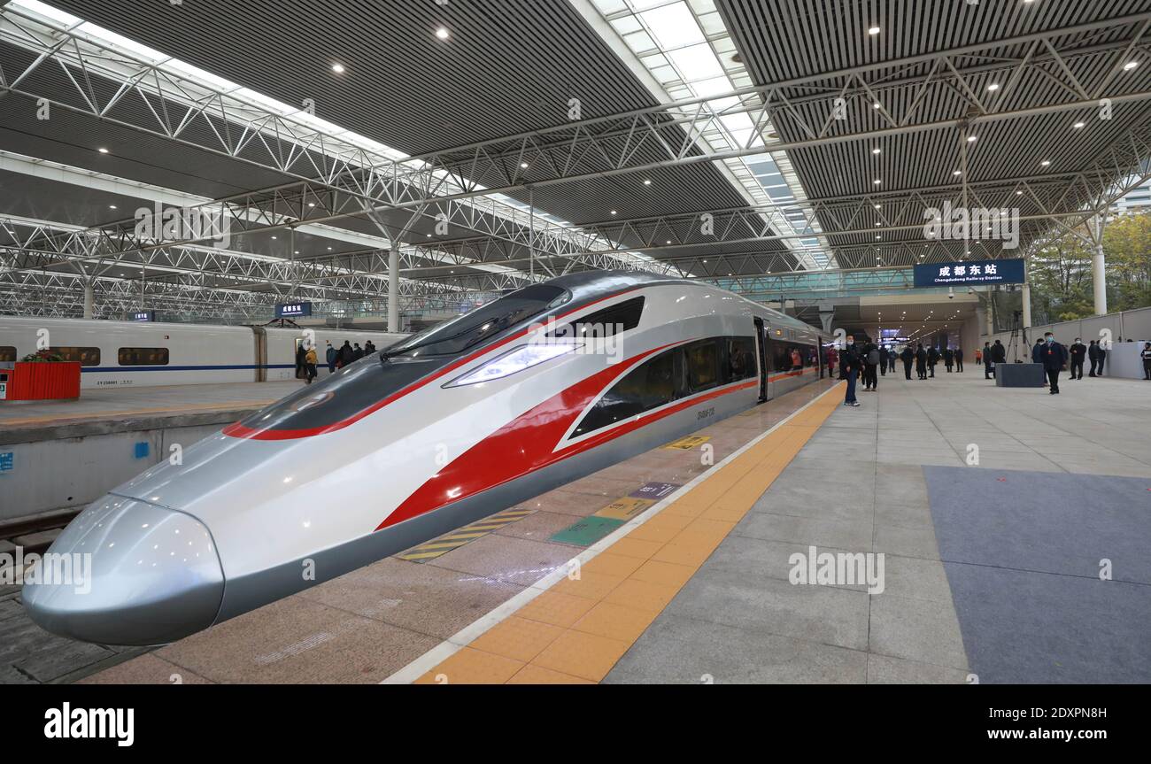 201224) -- CHENGDU, Dec. 24, 2020 (Xinhua) -- The Fuxing high-speed train  G8607 bound for Shapingba Railway Station in southwest China's Chongqing,  sets out from the Chengdu East Railway Station in southwest