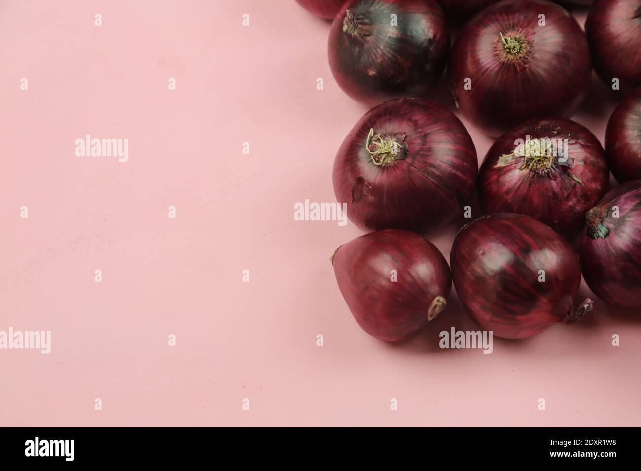 sweet red onions on background Stock Photo