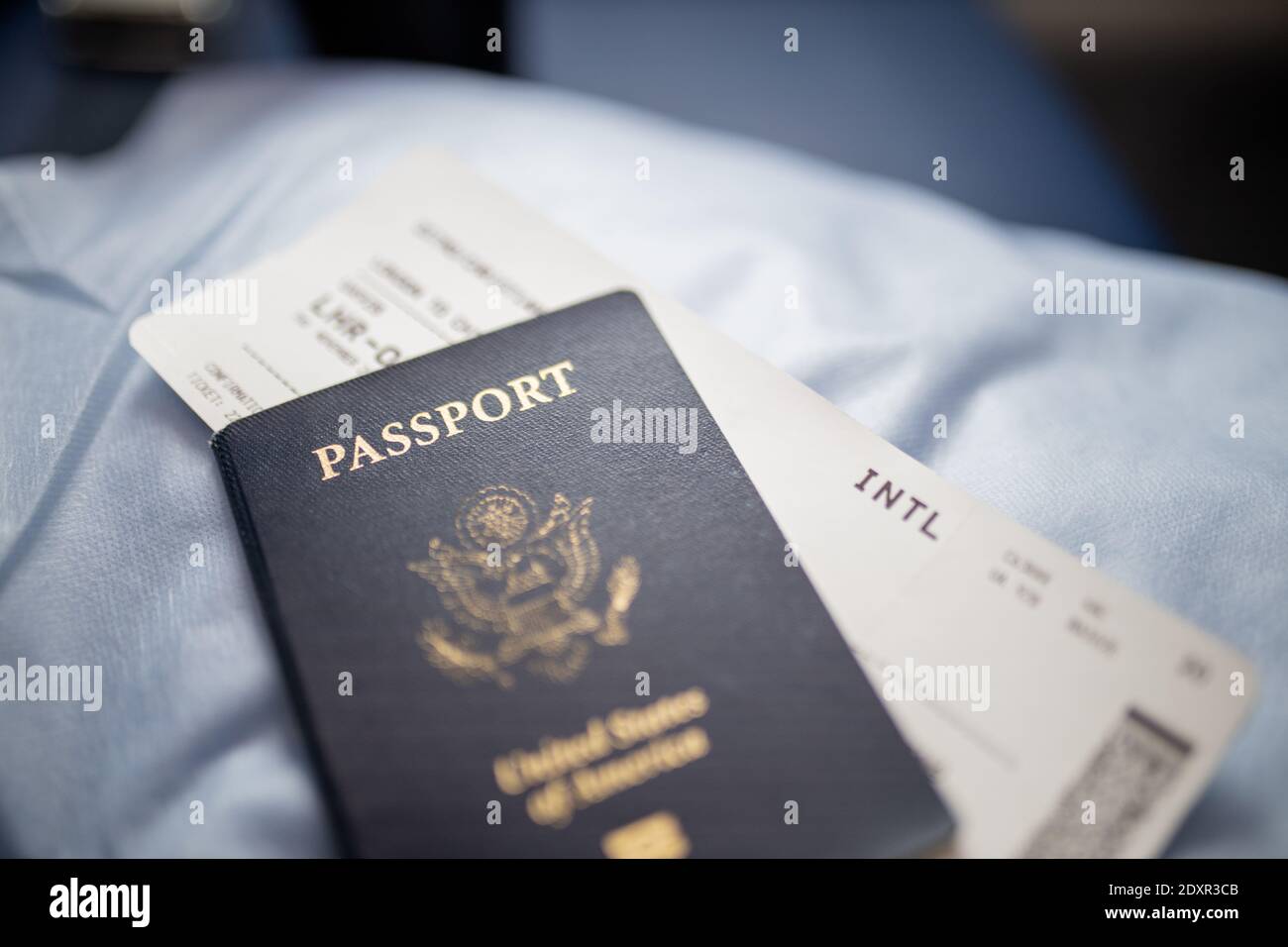 American passport and airplane ticket above a seat Stock Photo Alamy