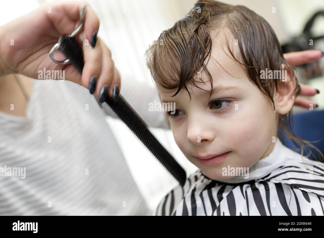 https://c8.alamy.com/comp/2DXR64R/portrait-of-a-boy-in-the-barbershop-2DXR64R.jpg