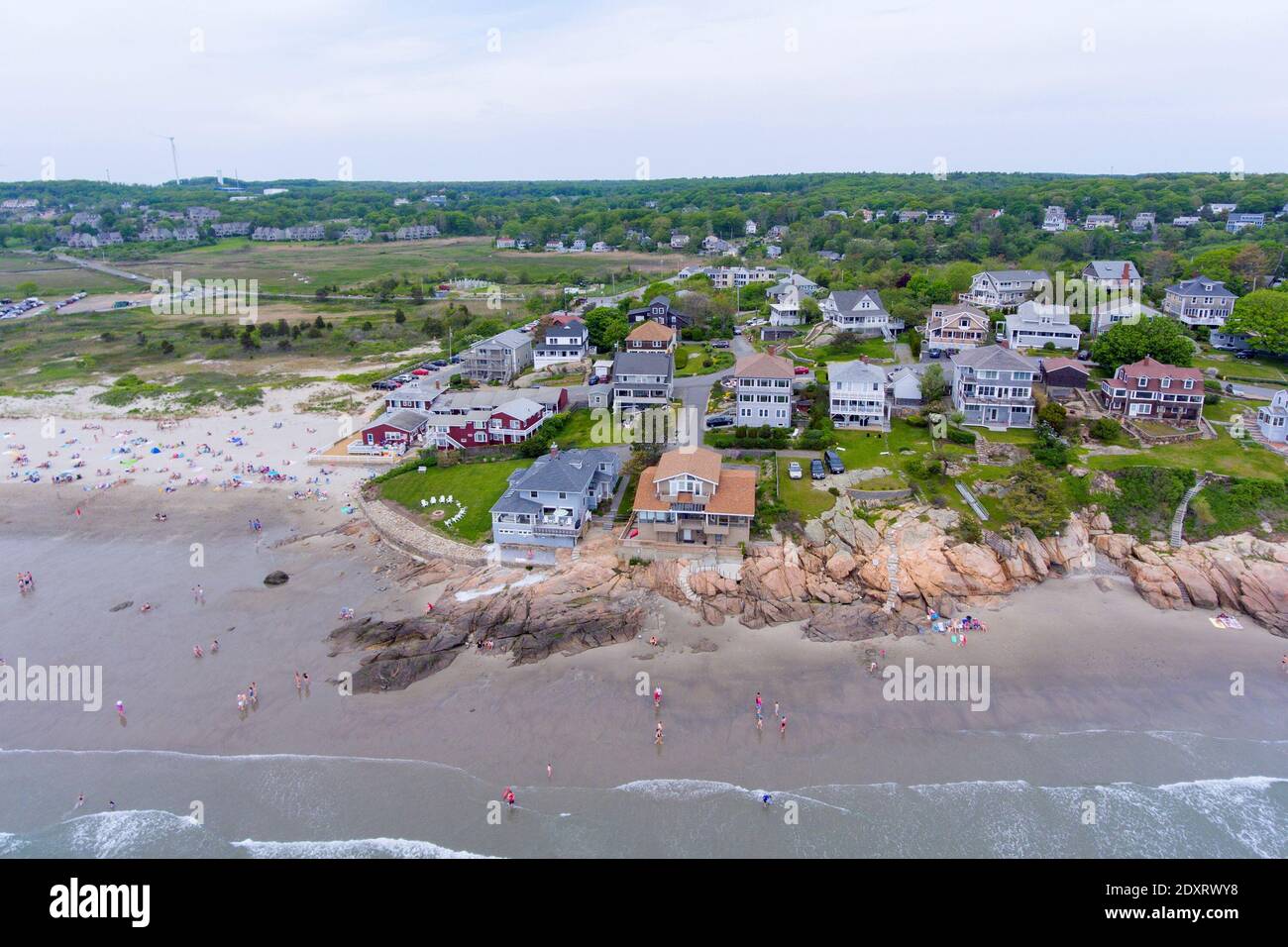 Historic waterfront buildings next to Good Harbor Beach aerial view in Gloucester, Cape Ann, Massachusetts MA, USA. Stock Photo