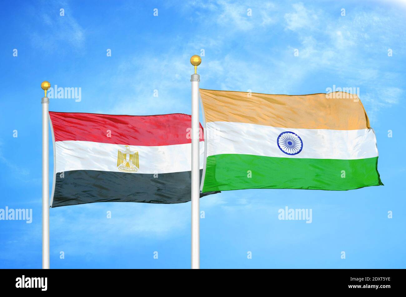 Egypt and India two flags on flagpoles and blue cloudy sky Stock Photo