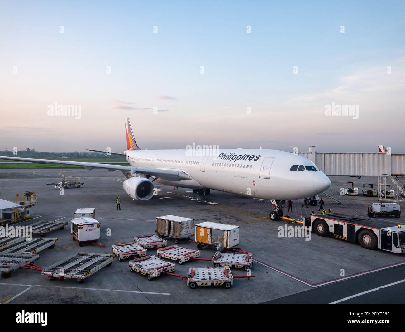 Philippine Airlines Airbus A330 being readied for departure early in the morning at Terminal 2 of Ninoy Aquino International Airport in Manila, Philip Stock Photo