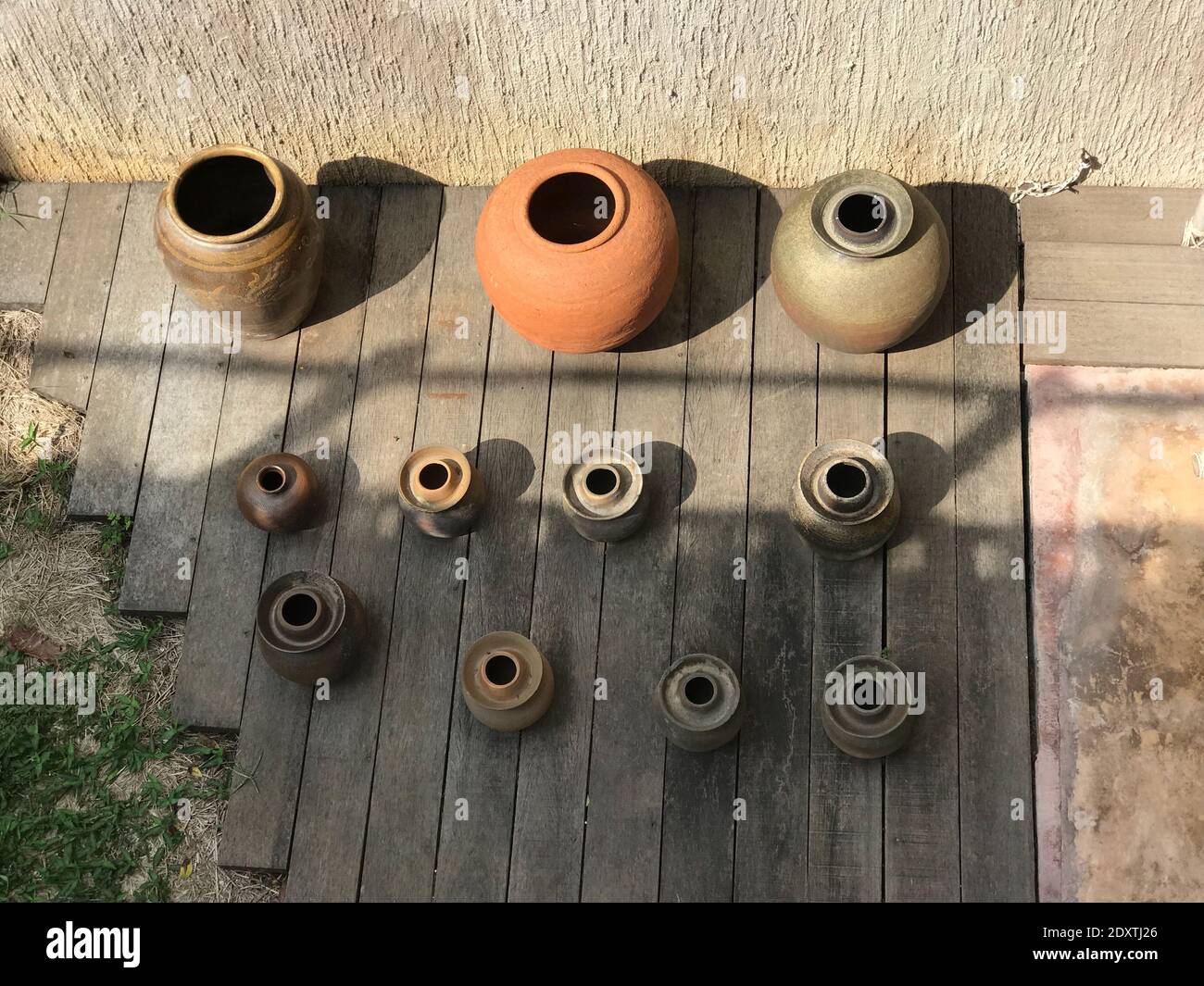 High Angle View Of Earthen Pots On Wooden Planks Stock Photo