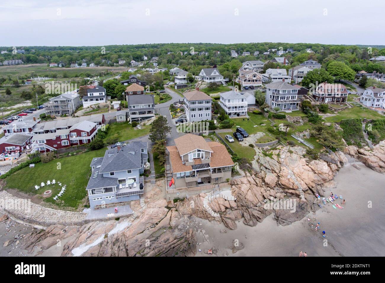 Historic waterfront buildings next to Good Harbor Beach aerial view in Gloucester, Cape Ann, Massachusetts MA, USA. Stock Photo