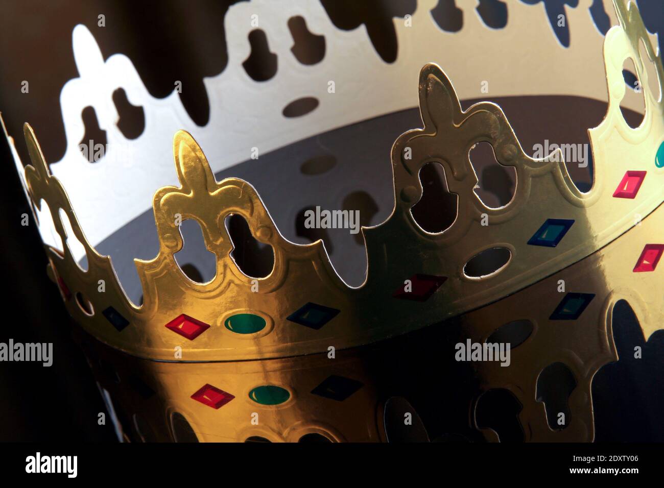 Traditional French crown of galette des rois on dark background - Stock Image