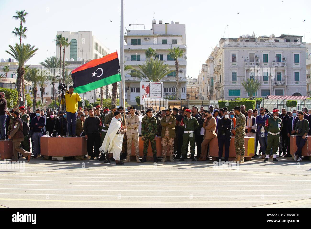 Tripoli, Libya 24th Dec 2020, Tripoli, Libya 24th Dec 2020, An old Libyan man holding Libyan flag in the middle of the crowd. Credit: Hussein Eddeb/Alamy Live News Stock Photo