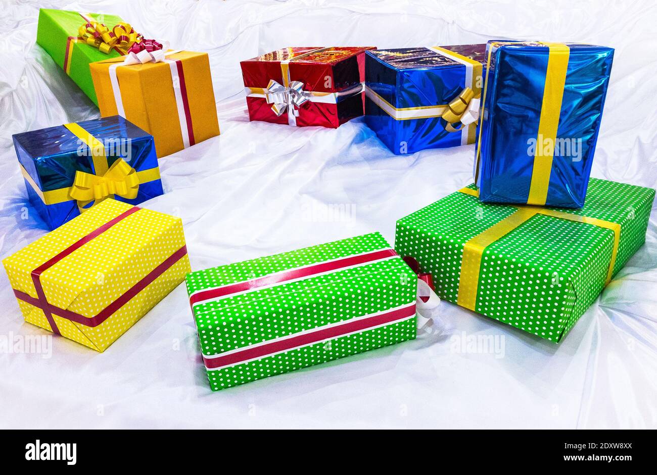 colorful gift boxes on stilized snow Stock Photo
