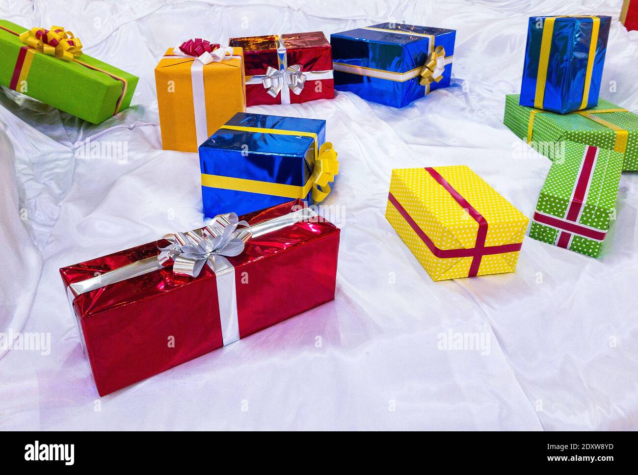 colorful gift boxes on stilized snow Stock Photo