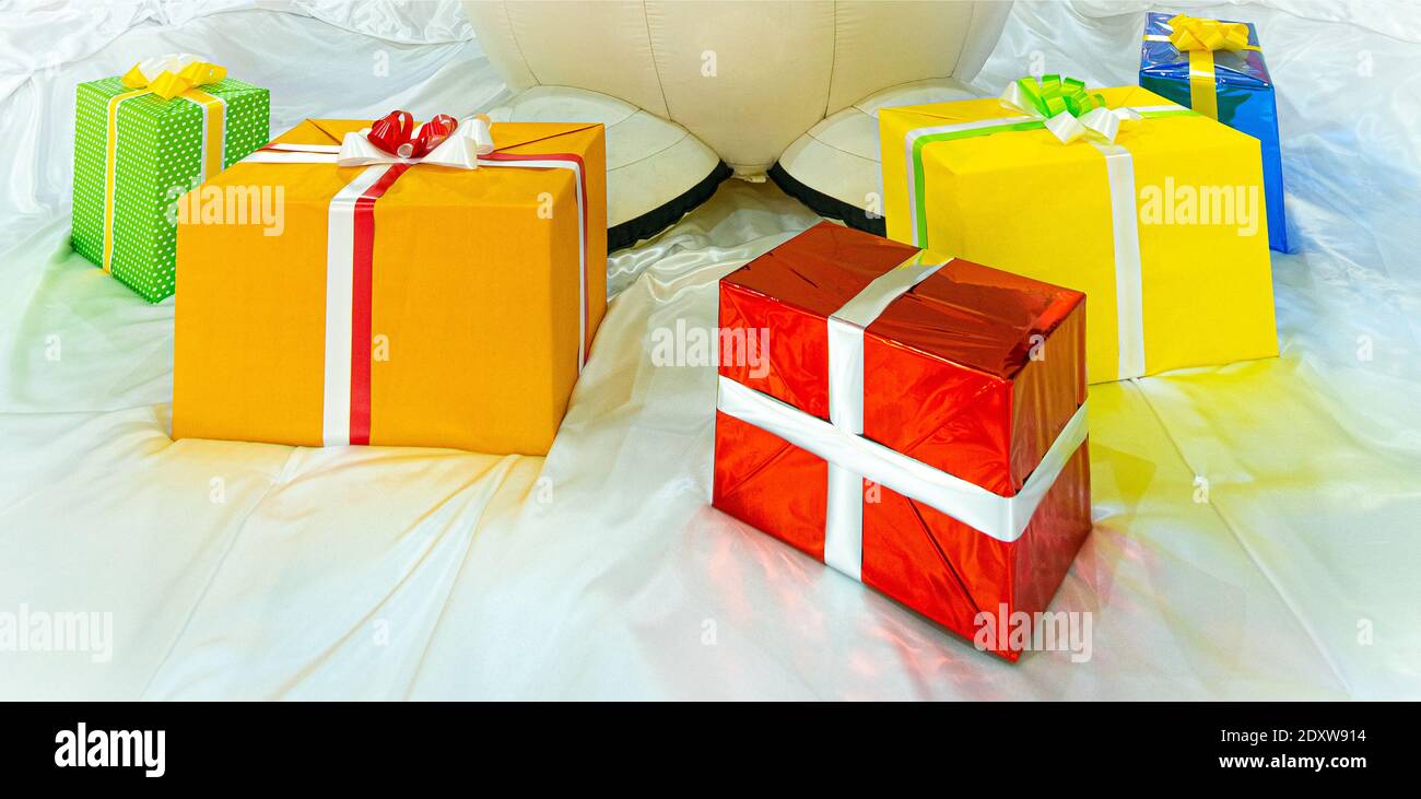 colorful gift boxes on stilized snow Stock Photo