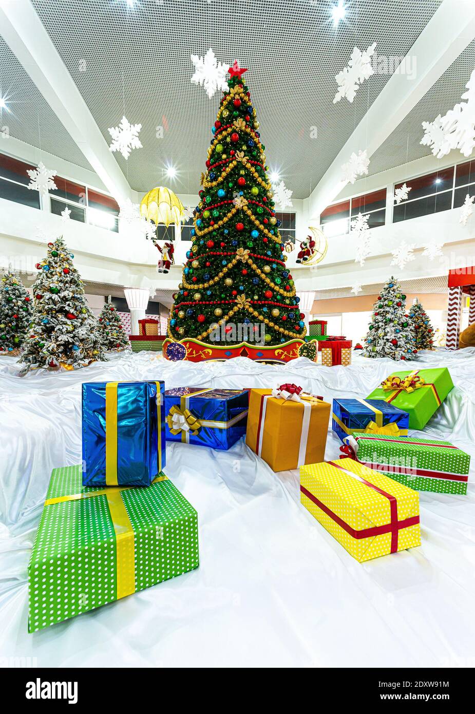 gift boxes under Christmas tree, indoor Stock Photo Alamy