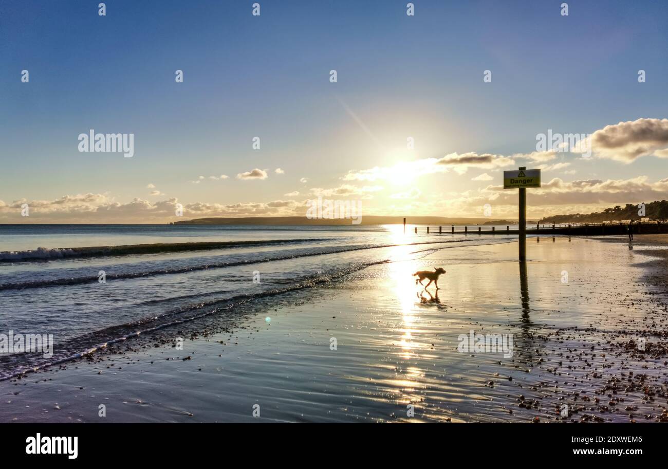 Bournemouth, UK. 24th Dec, 2020. People on the beach enjoy some winter sun in Bournemouth. Credit: Thomas Faull/Alamy Live News Stock Photo