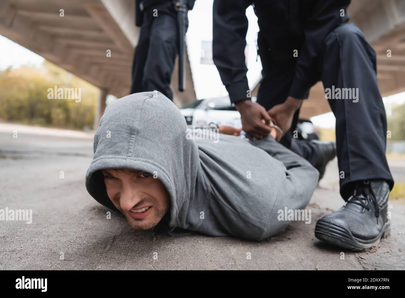 Policewoman handcuffing man hires stock photography and images Alamy