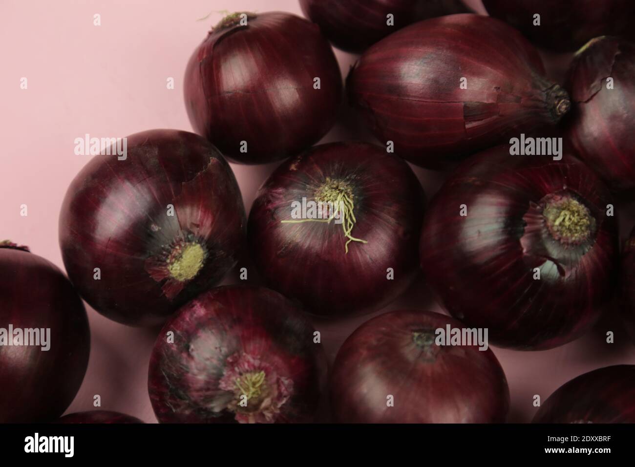 sweet red onions on background Stock Photo