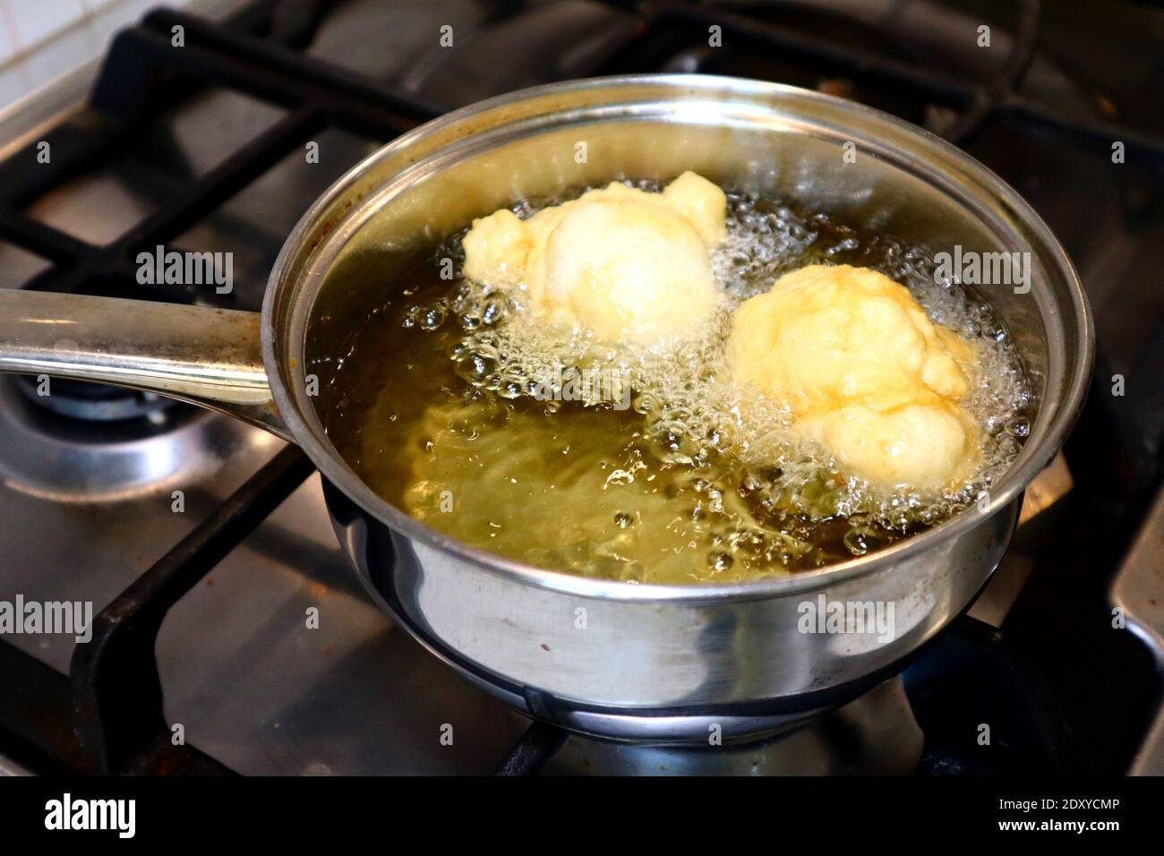SFINCI Traditional Sicilian Italian Fried Doughnuts while frying in