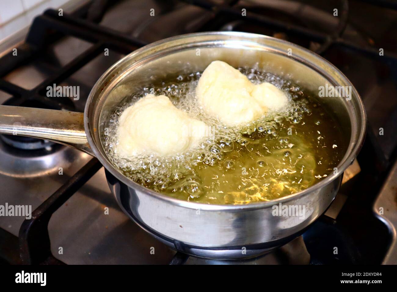SFINCI Traditional Sicilian Italian Fried Doughnuts while frying in