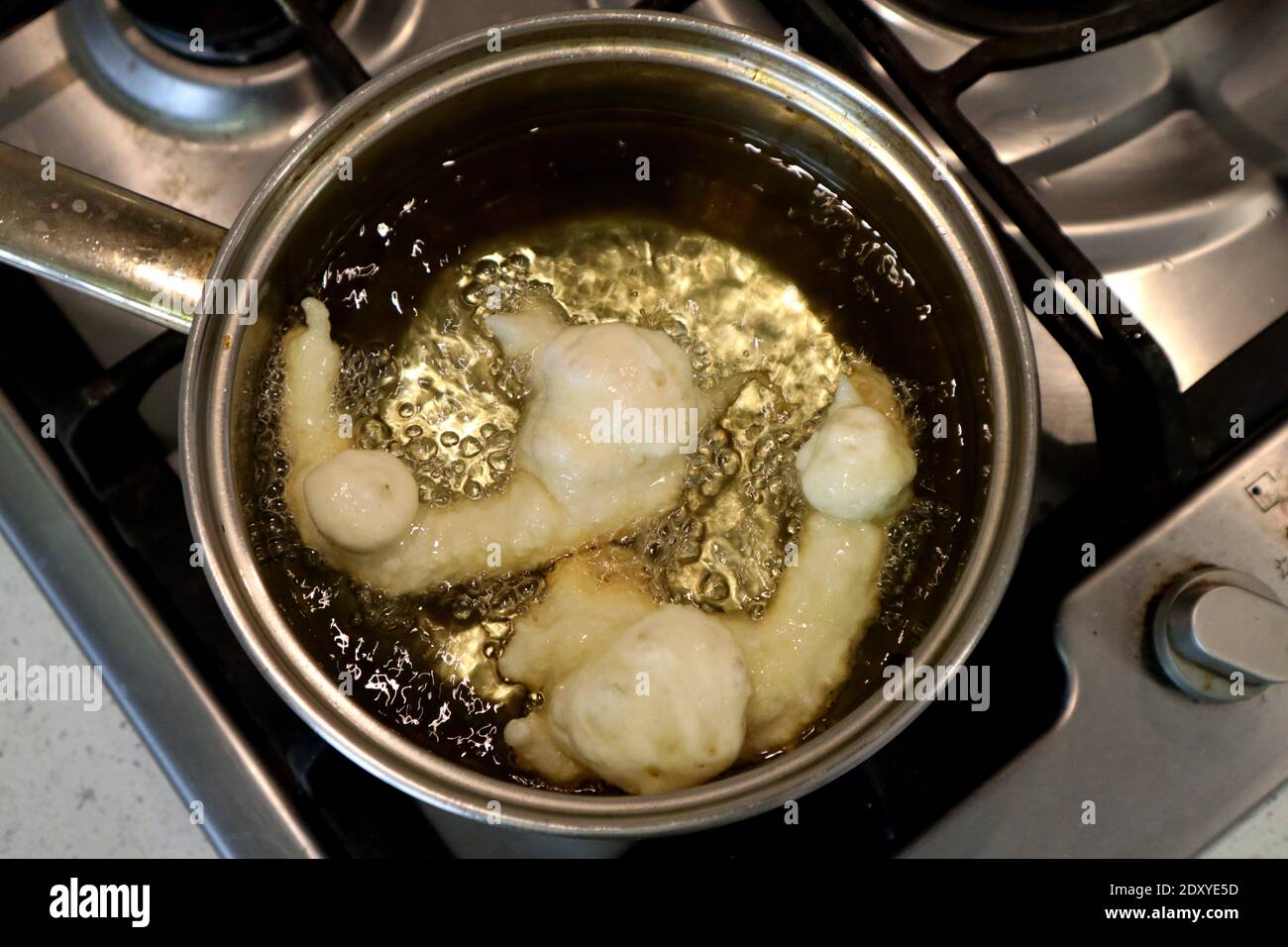 SFINCI Traditional Sicilian Italian Fried Doughnuts while frying in