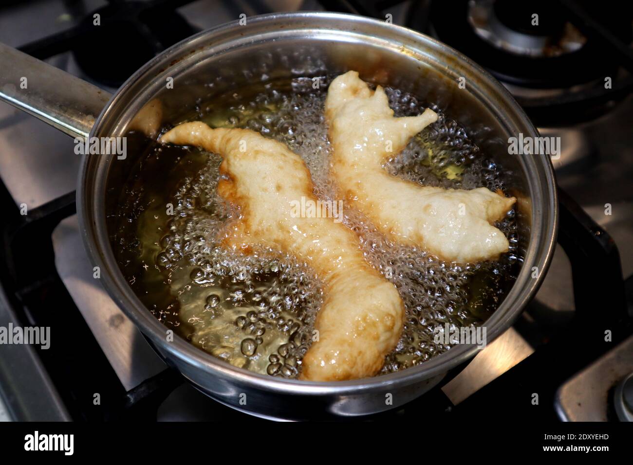 SFINCI Traditional Sicilian Italian Fried Doughnuts while frying in