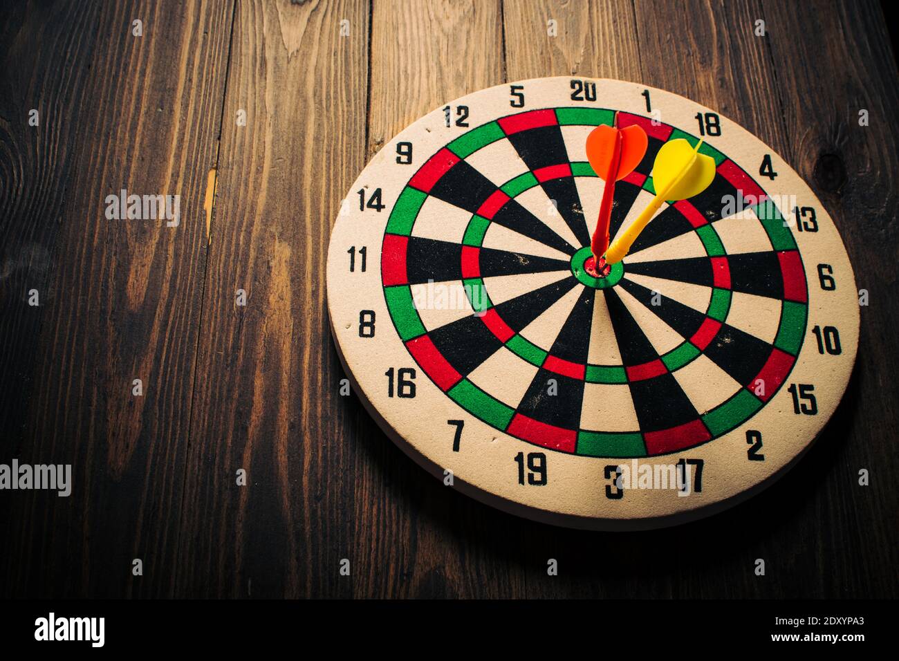 Dartboard on wood wall darts hi-res stock photography and images - Alamy