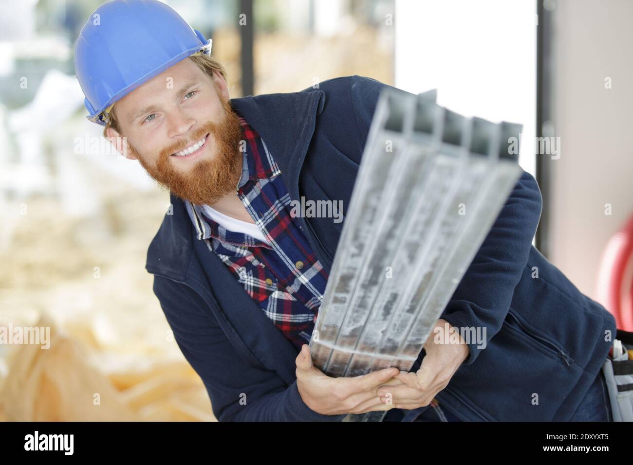 portrait of smiling worker on construction site Stock Photo - Alamy