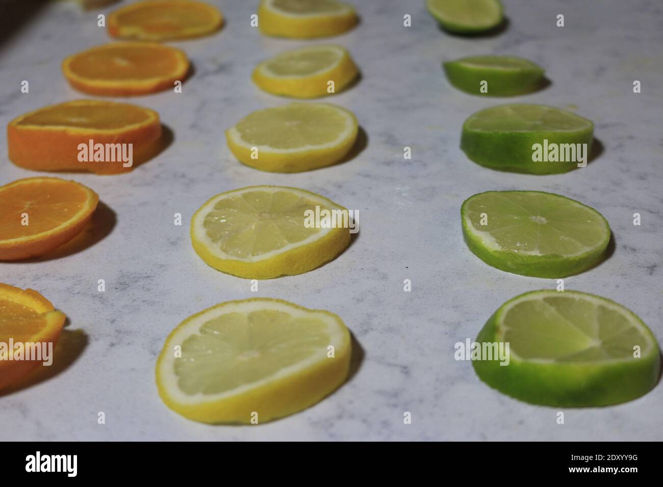 citrus lined up in a line. good background Stock Photo - Alamy