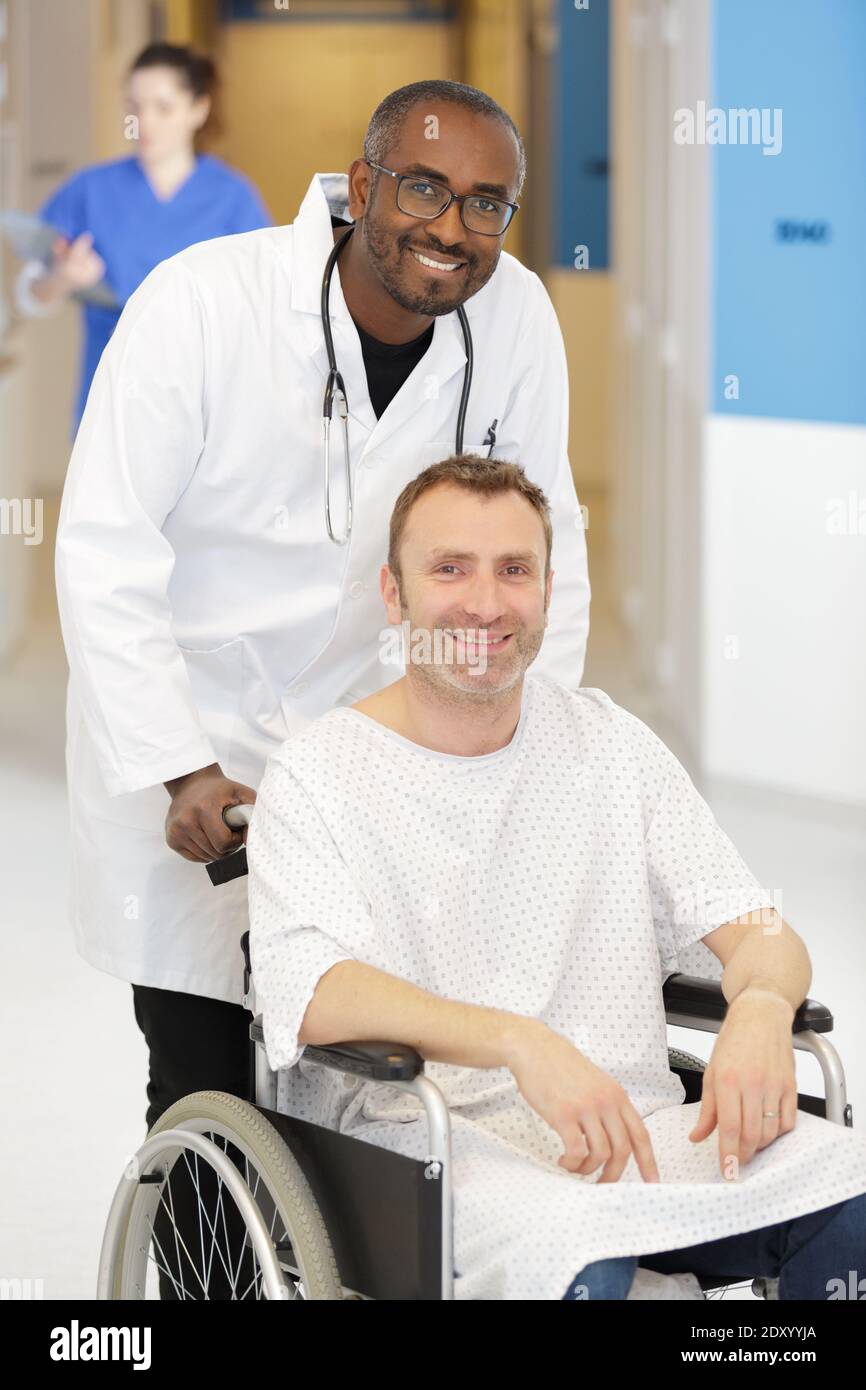 nurse pushing a wheelchair and patient in hospital Stock Photo - Alamy