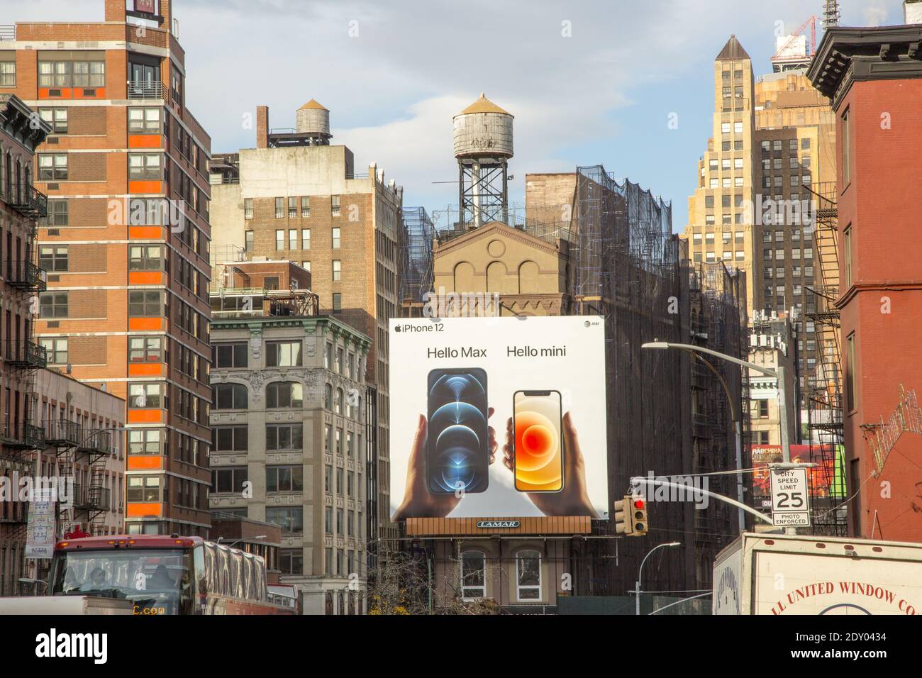 iphone billboard stands out on Canal Street in Manhattan surronded by New York rooftops, classic water towers and all. Stock Photo