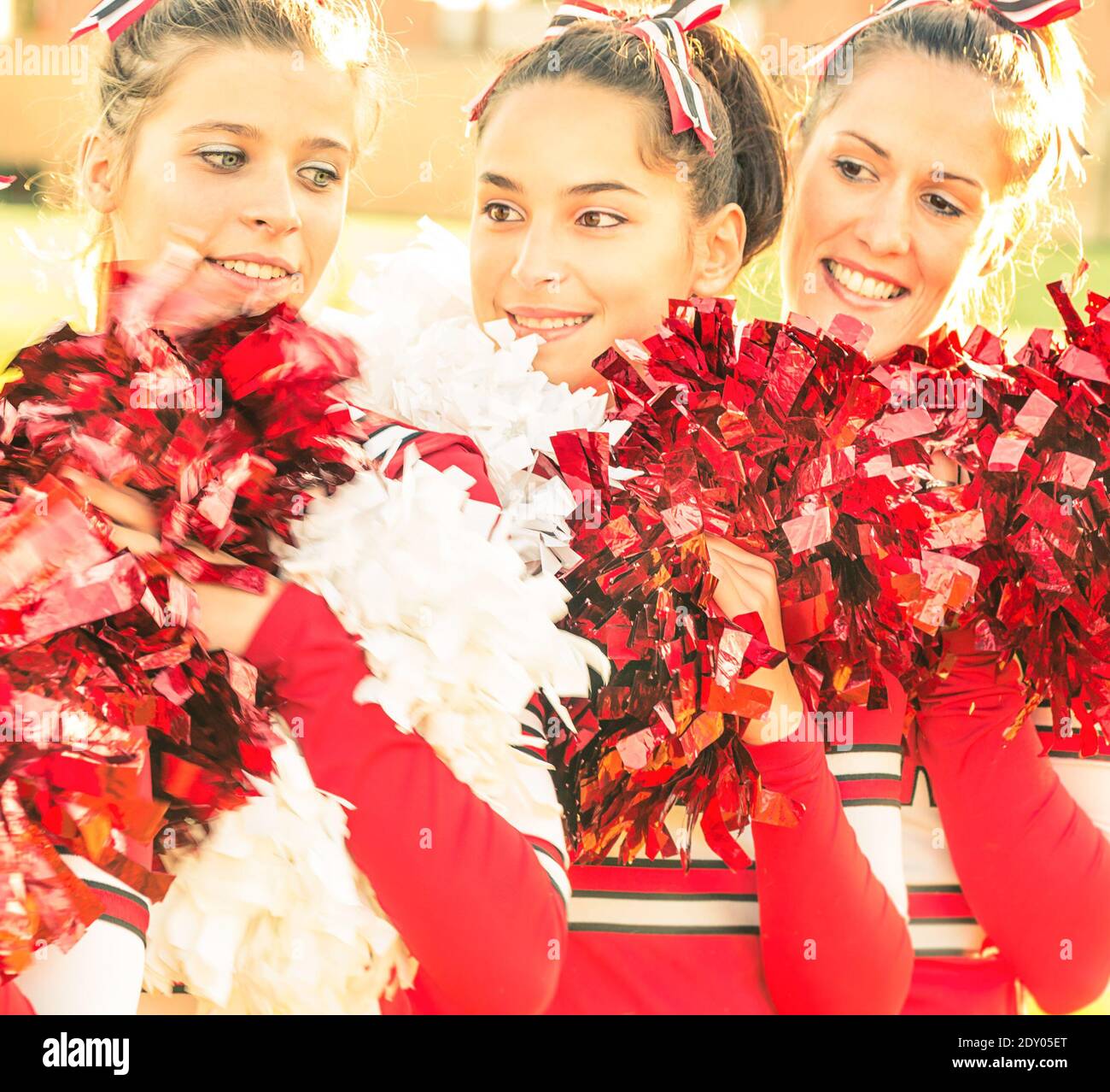 Closeup Of Beautiful Cheerleaders Holding Pompoms Stock Photo Alamy