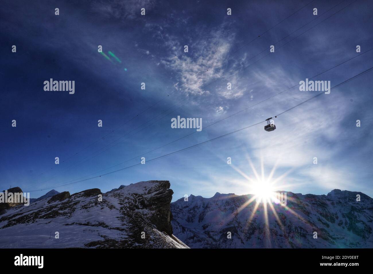 Low Angle View Of Snowcapped Mountains Against Sky - Fying High Stock Photo