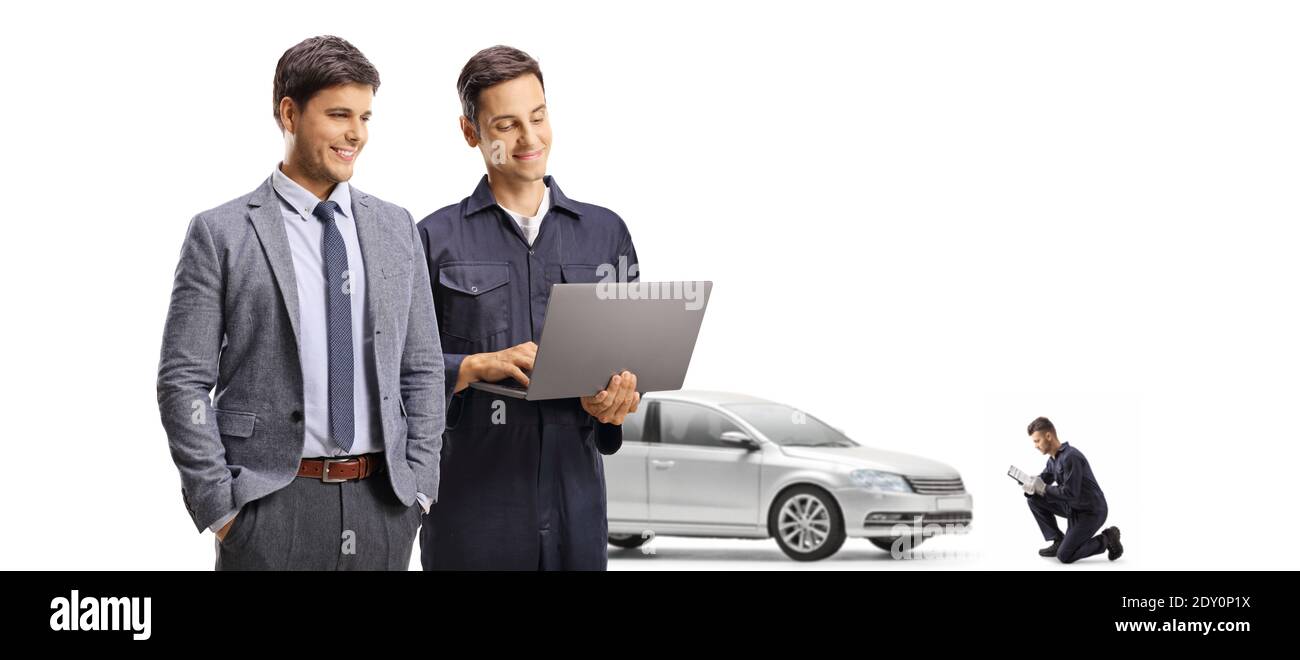 Male customer and a mechanic with a laptop computer isolated on white background Stock Photo