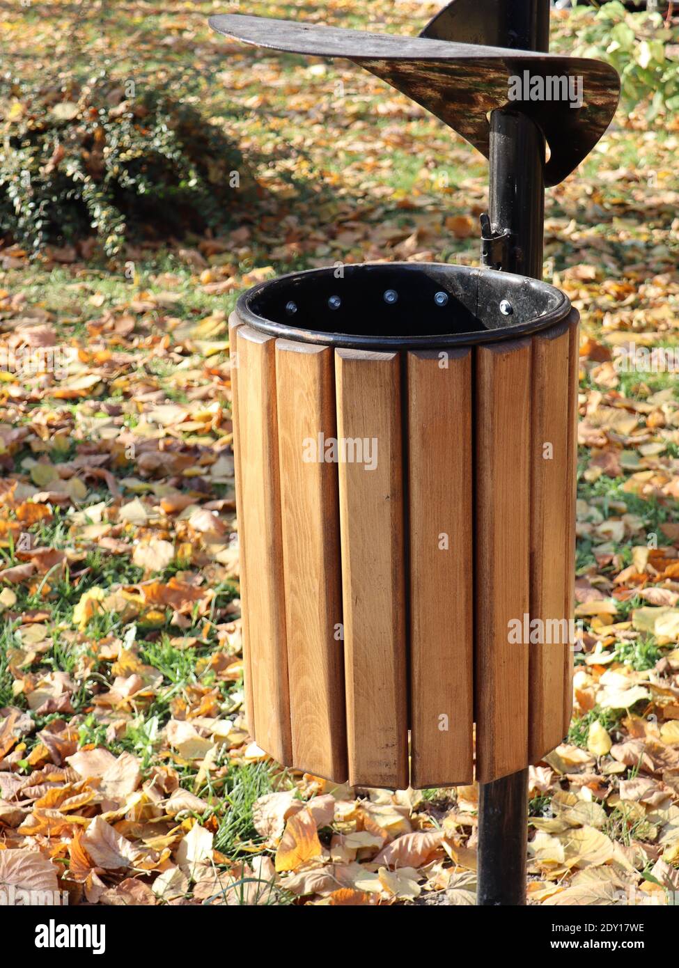 A vertical shot of a recycle bin in the park in autumn Stock Photo - Alamy