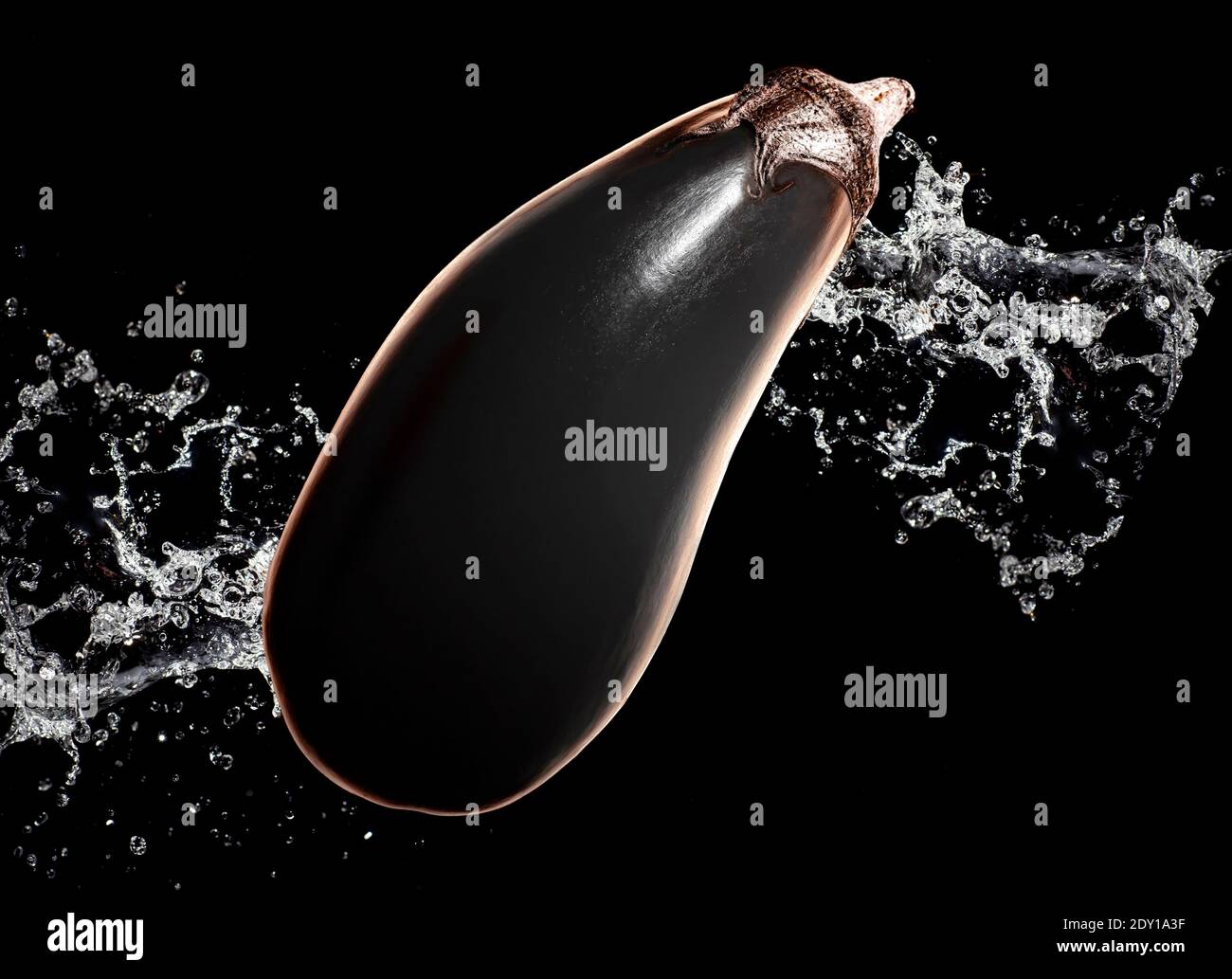 Glow eggplant with water splash on black background Stock Photo Alamy