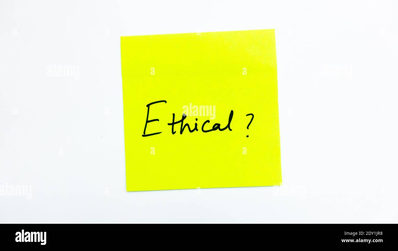 Ethical question on a yellow sticky note with white background Stock Photo