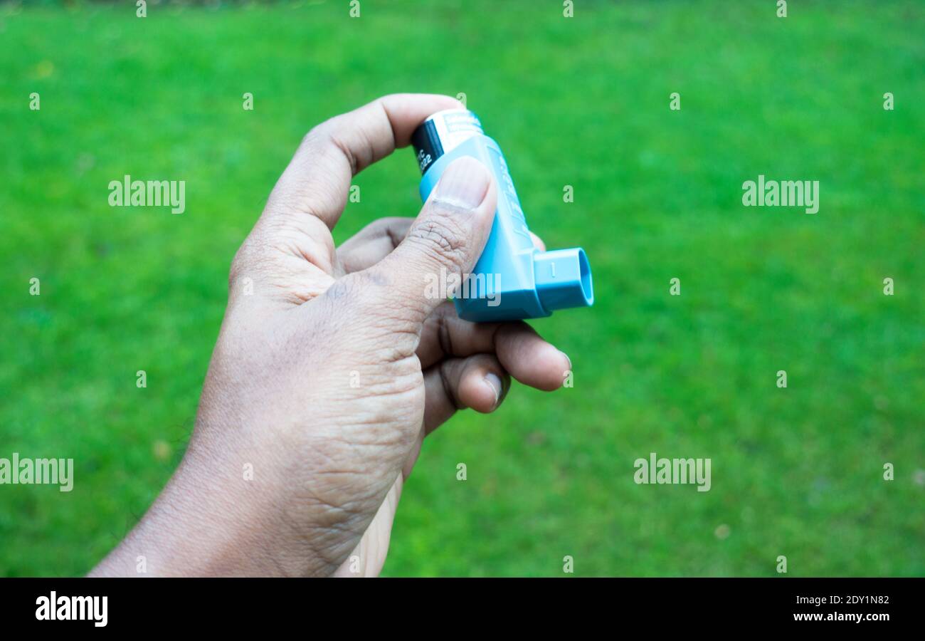 Asthma blue cap reliever spray in operating position Stock Photo