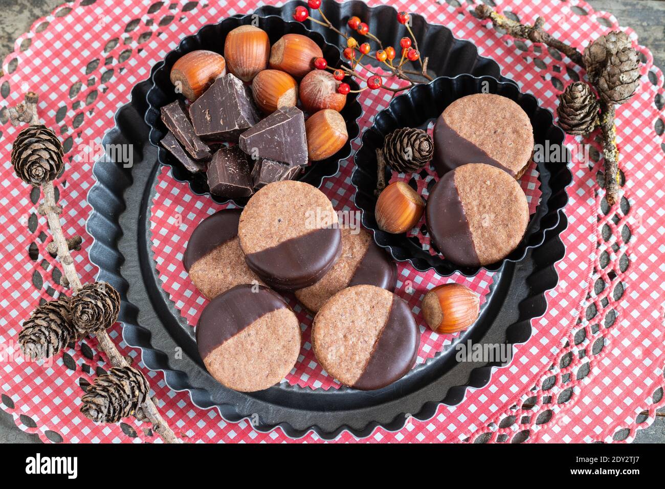 chocolate cookies with hazelnuts on baking pan Stock Photo