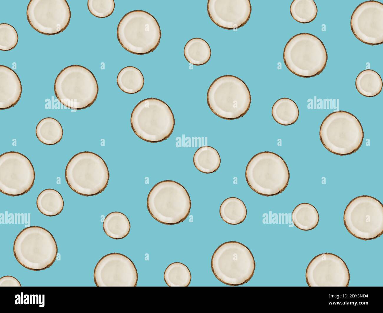 minimalistic tropical pattern with exotic coconut fruit on a blue background Stock Photo