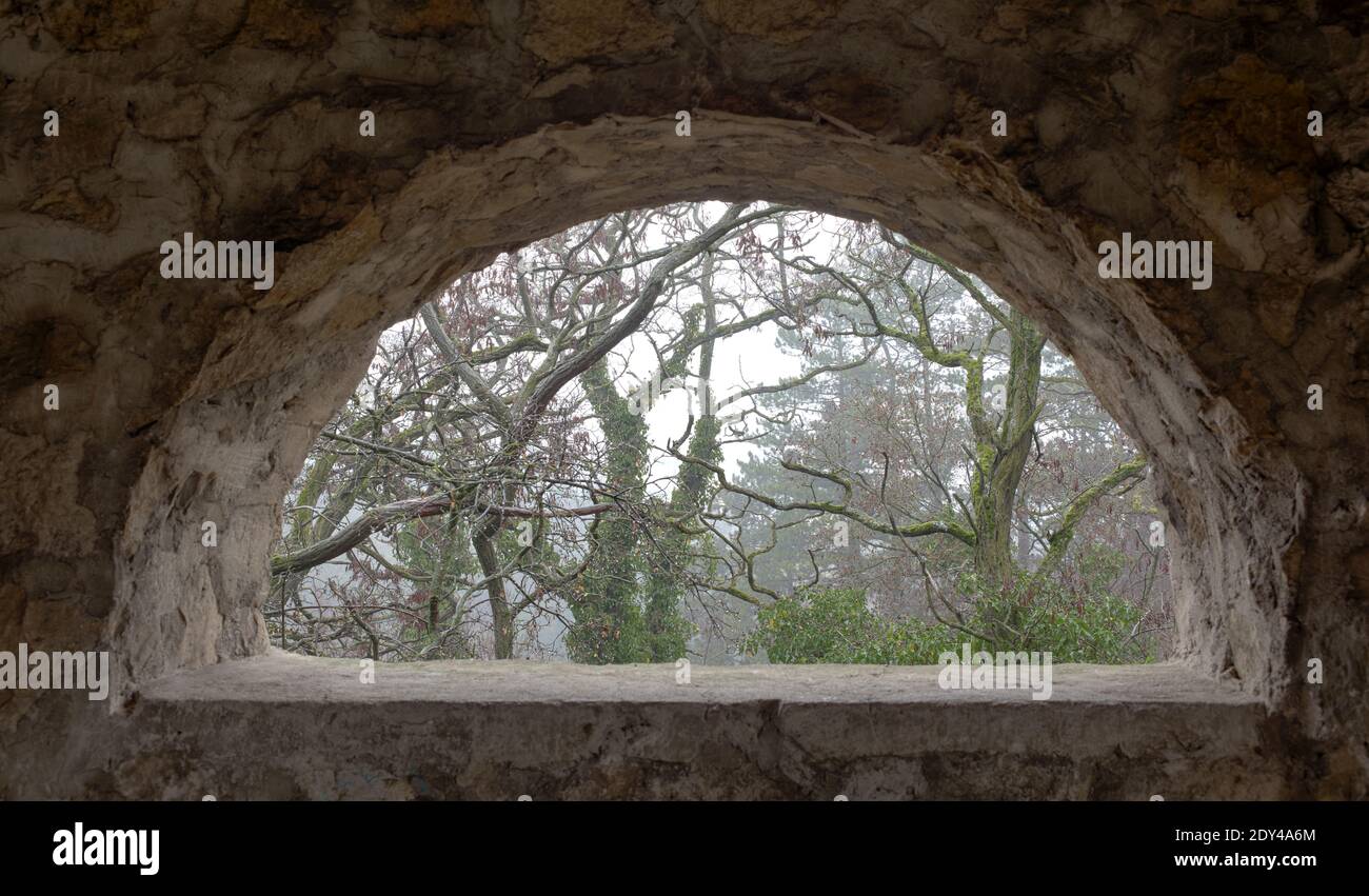 Window of a belfry ruin near All Saints Church (Kostol Vsetkych Svatych) near Haluzice Gorge (Haluzicka Tiesnava) in Slovakia Stock Photo