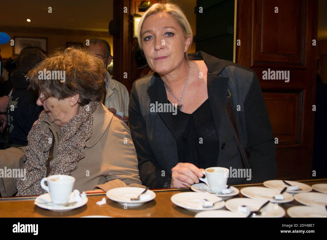 Exclusive. French far-right Front National party president Marine Le Pen  enjoys a coffee during her visit to Calais, northern France on October 24,  2014. Le Pen came to the northern port town
