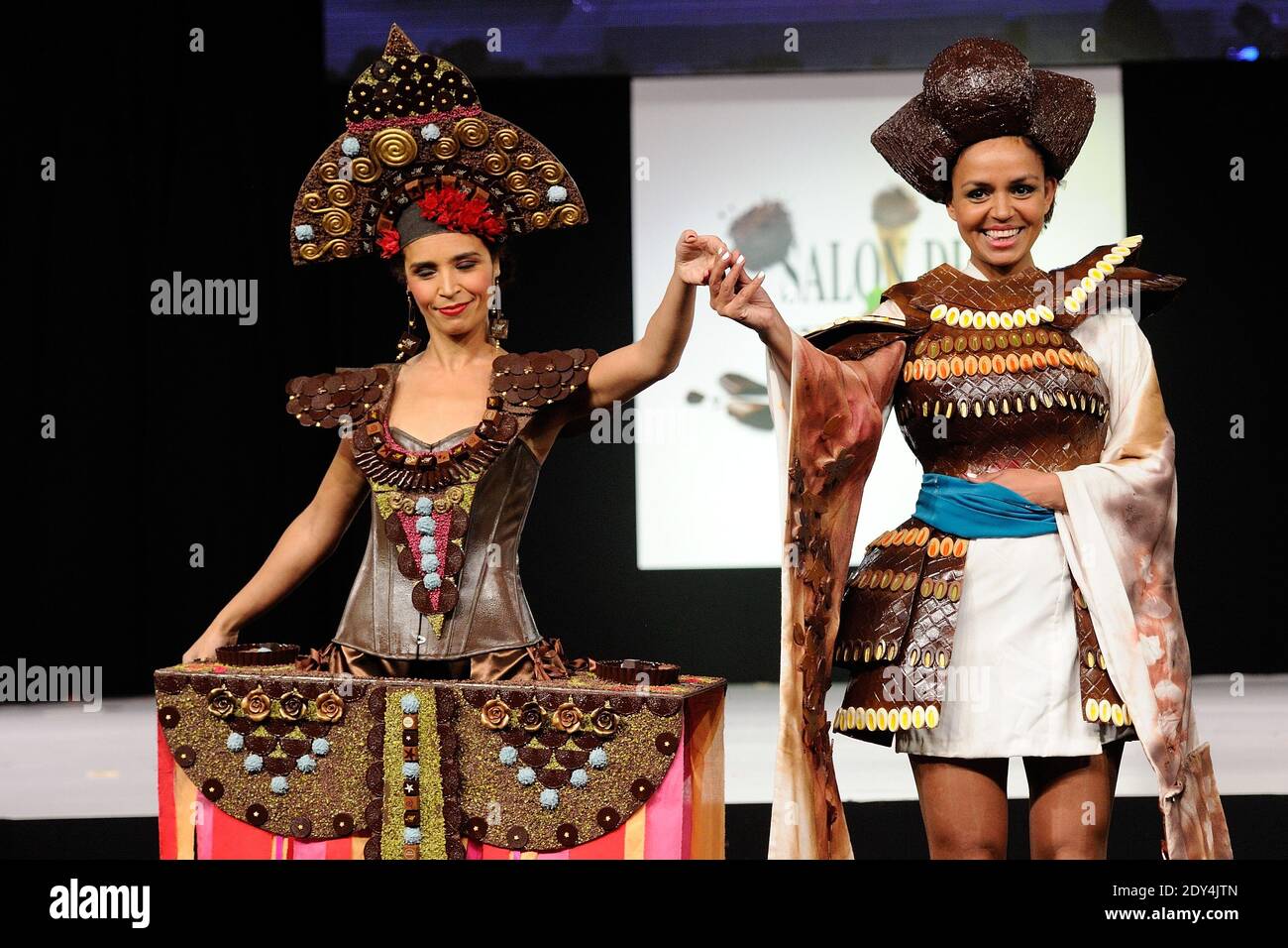 Aida Touhiri displaying a dress designed by Maison Rannou-Metivier and Laurence Roustandjee displaying a dress designed by Audrey Lempeseur and chocolated by Frederic Cassel during the 20th Salon du Chocolat held at Porte de Versailles in Paris, France on October 28, 2014. Photo by Aurore Marechal/ABACAPRESS.COM Stock Photo