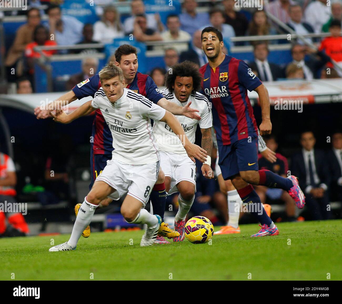 Toni Kroos, Real Madrid, left, here with Lilonel Messi, FC Barcelona ,right and Marcelo, Real Madrid, far right and Luis Suarez, Barcelona, behind during the Spanish La Liga soccer match, Real Madrid Vs FC Barcelona at Santiago Bernabeu stadium in Madrid, Spain on October 25, 2014. Photo by Giuliano Bevilacqua/ABACAPRESS.COM Stock Photo