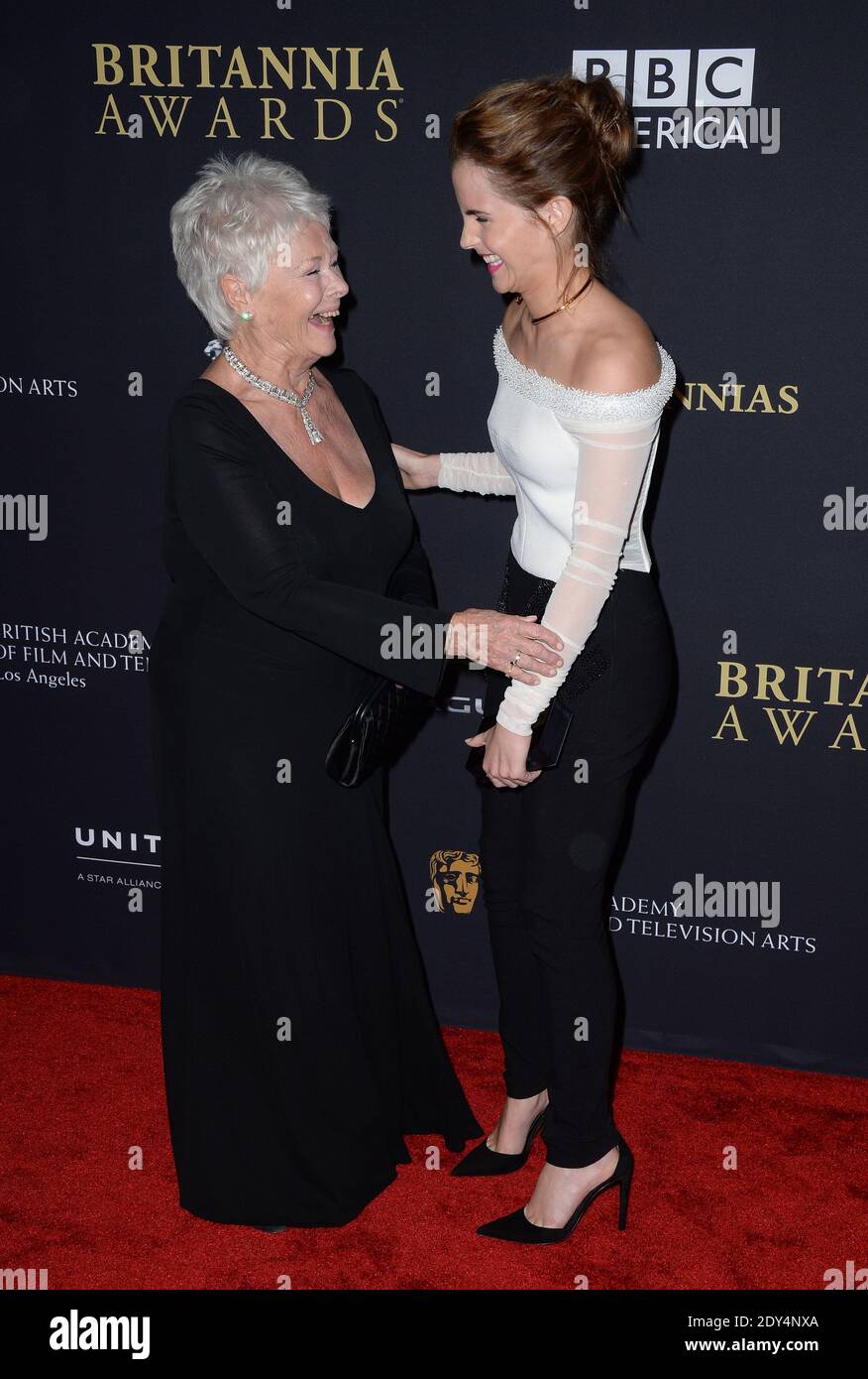 Judi Dench and Emma Watson attend the BAFTA Los Angeles Britannia