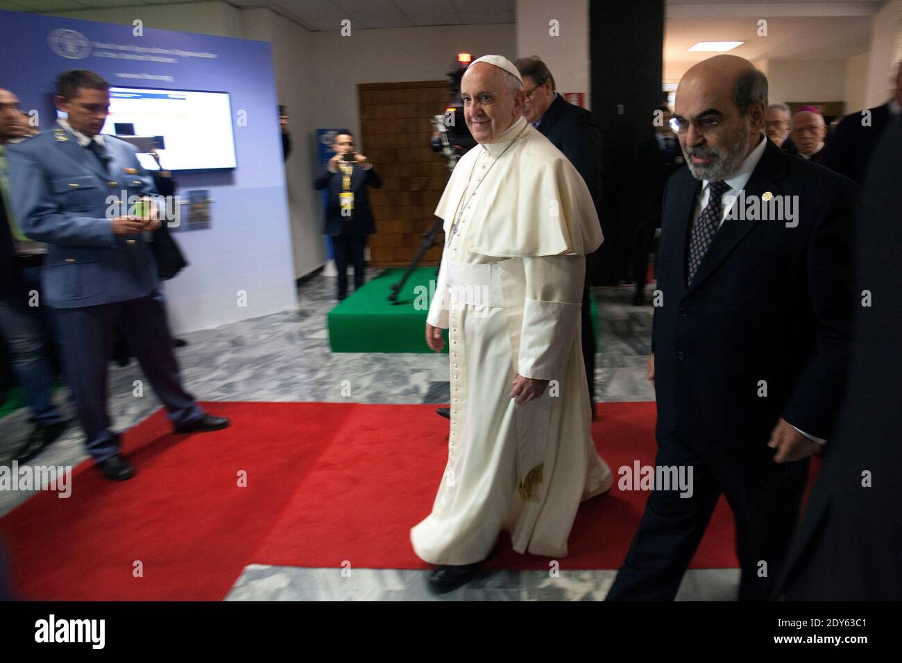 Pope Francis is welcomed by U.N. Food and Agriculture Organization (FAO)  Director-General Jose Graziano da Silva as he arrives to attend the 2nd  International Conference on Nutrition and Growth hosted by the