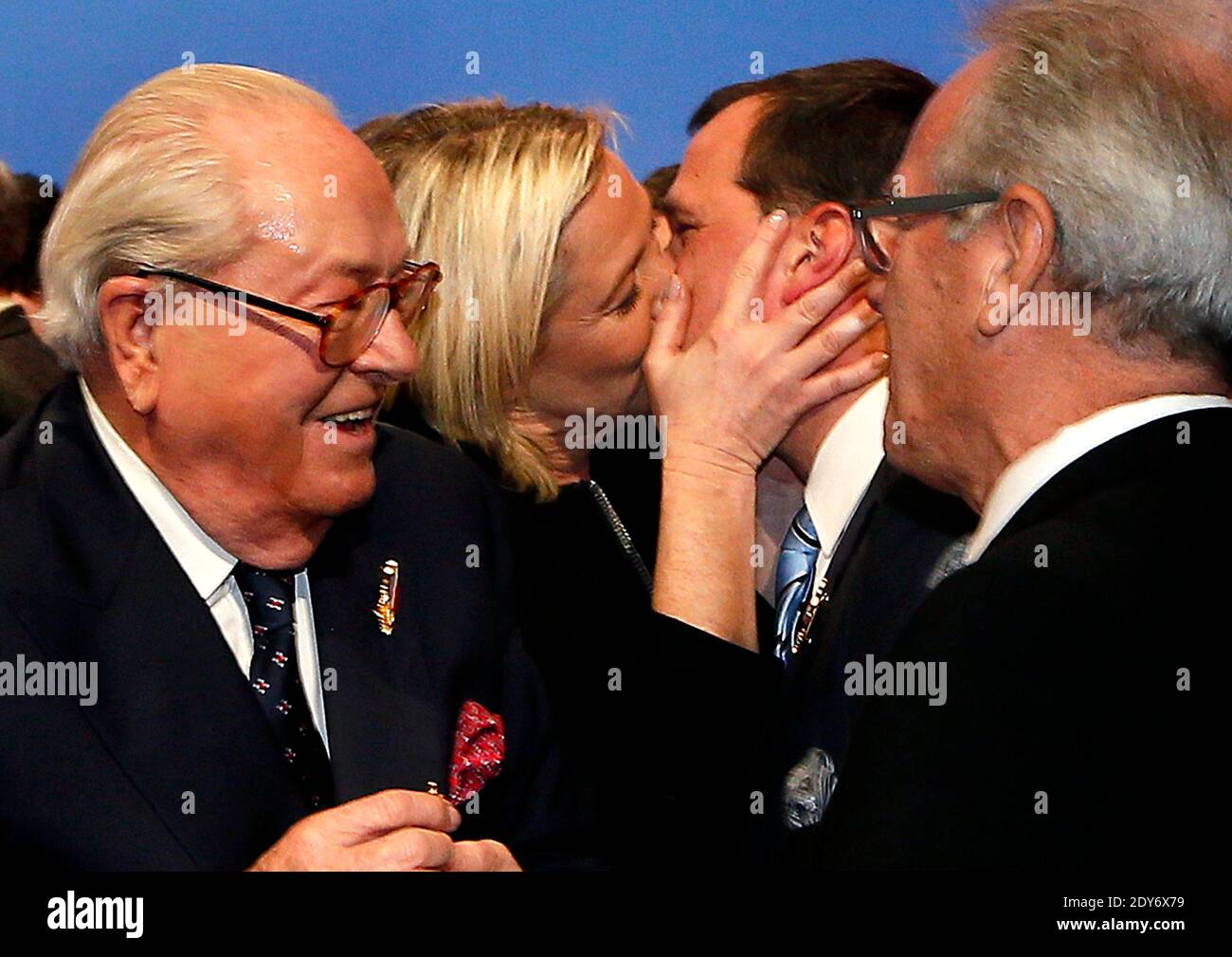 France's far-right National Front party's leader Marine Le Pen kiss her  boyfriend Louis Aliot, with Jean-Marie le Pen at the 15th congress of the  party, in Lyon, France on November 29, 2014.