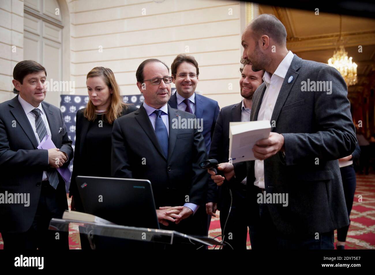 French President Francois Hollande along with Secretary of State for Digital Economy Axelle Lemaire, Minister for Cities, Youth and Sport Patrick Kanner and Secretary of State for Foreign Trade, Tourism Promotion and French Citizens Living Abroad Matthias Fekl at a reception at the Elysee Palace as part of the Social Good Week 2014, in Paris, France on December 4, 2014. Photo Pool by Thomas Padilla/ABACAPRESS.COM Stock Photo